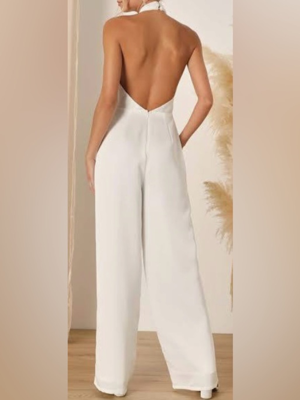 white halter neck wide-leg jumpsuit from Zara.